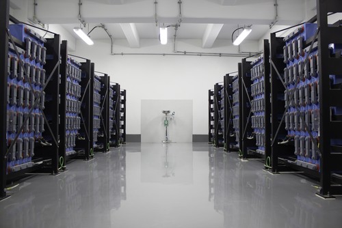 A large room full of racks of servers.