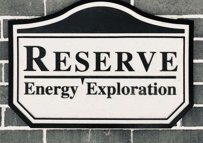 A black and white photo of a sign that says reserve energy exploration.