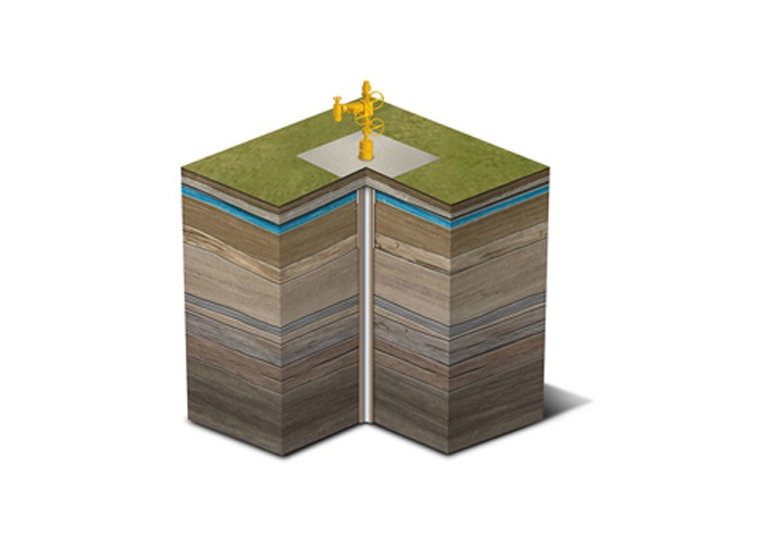 A diagram of an oil well with a yellow man standing on top of it.